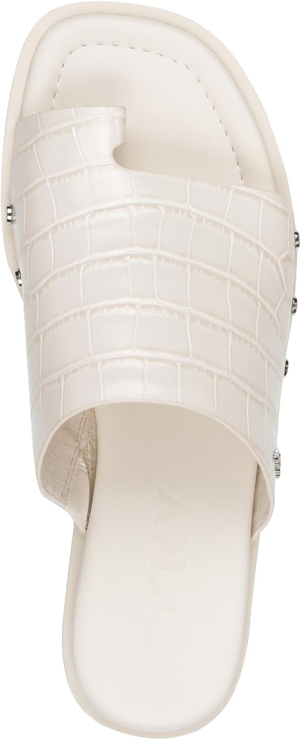 image:imageDKNY womens Colwyn Flat Sandal With Toe Loop and Stud EmbellishmentsCoconut